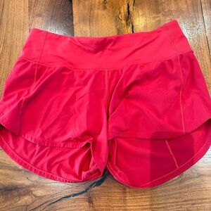 Lululemon 4-inch Speed Up Mid-Rise Lined Short, size 6, color red.